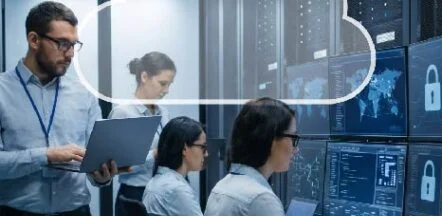 IT professionals monitor security dashboards in a data center, with a cloud icon overlay.