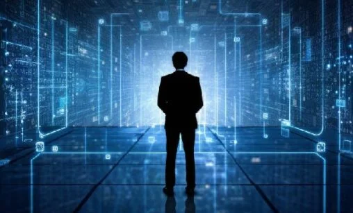 Silhouette of a businessperson in a suit standing in a glowing blue digital data tunnel.
